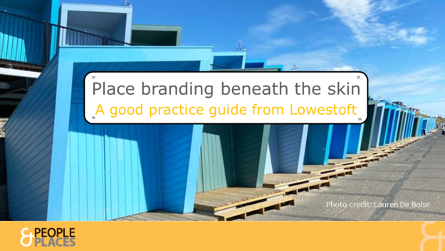 Bright blue beach huts with text